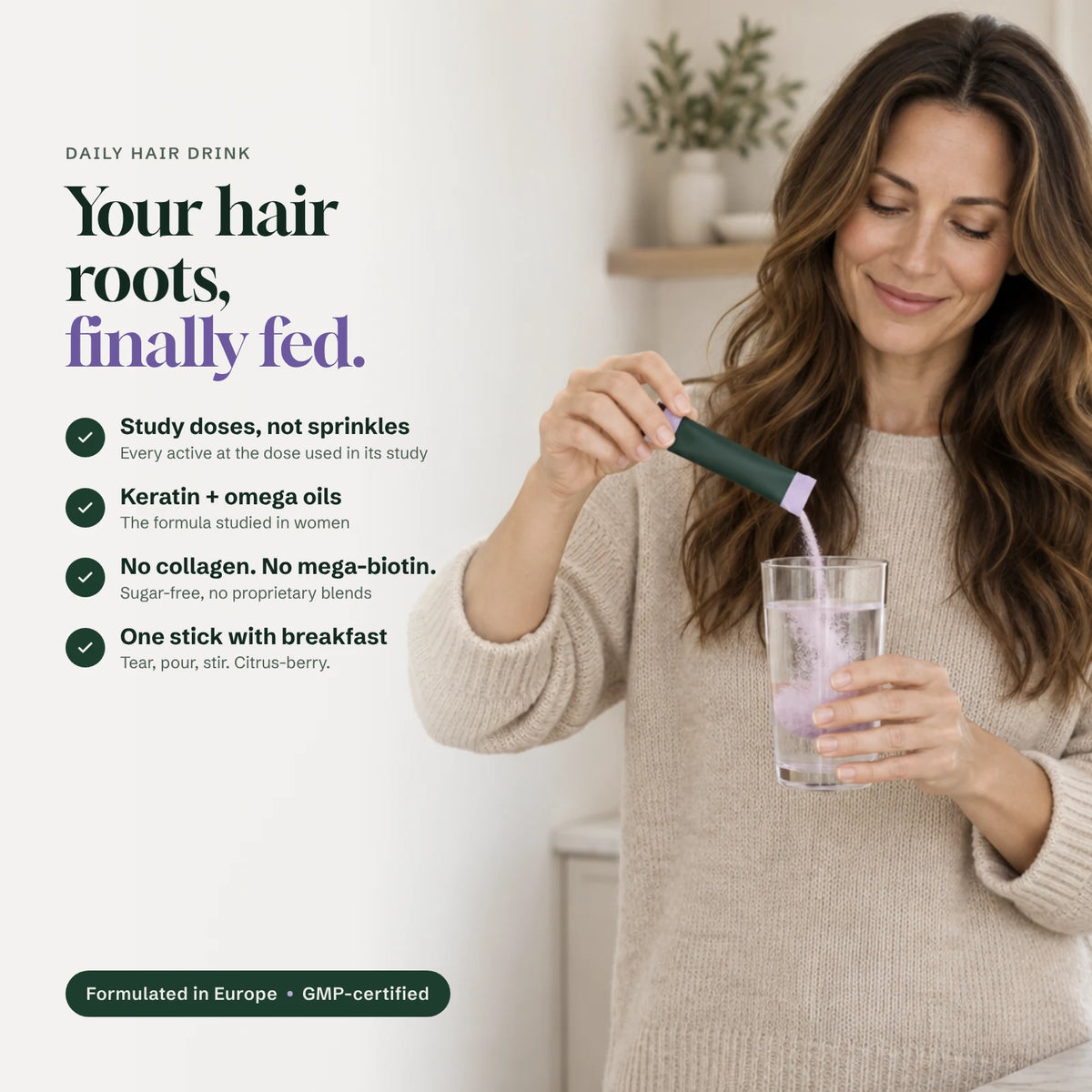 Woman pouring a Rootsense stick into a glass of water. Study doses, keratin and omega oils, no collagen or mega-biotin, one stick with breakfast.
